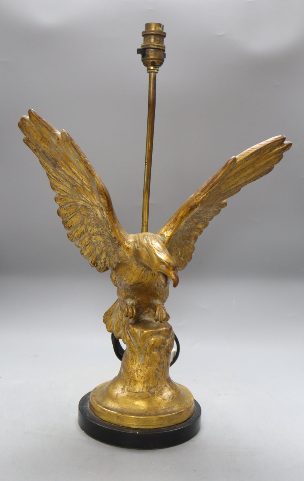 A gilt eagle table lamp